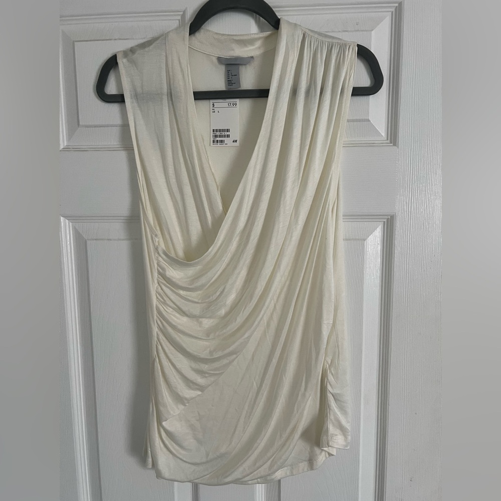 H&M wrap blouse. Ruching at waist and shoulder. Off white, size Large. NWT.